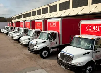 CORT delivery trucks lined up at the warehouse in Corpus Christi, TX.